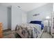 This charming bedroom features soft blue walls, decorative accents, and a lovely queen-sized bed at 3235 Utah Dr, Deltona, FL 32738
