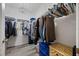 Organized walk-in closet provides ample storage with shelves and hanging rods, illuminated by a decorative light fixture at 3235 Utah Dr, Deltona, FL 32738
