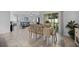 Open dining area with views of the living room and lanai, creating a seamless transition at 3235 Utah Dr, Deltona, FL 32738