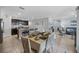 The dining room is adjacent to the kitchen and living room in an open floor plan at 3235 Utah Dr, Deltona, FL 32738