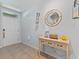 Welcoming entryway with a decorative table, mirror, and stylish tile flooring at 3235 Utah Dr, Deltona, FL 32738