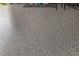 Close-up of the garage floor, showing its epoxy coating at 3235 Utah Dr, Deltona, FL 32738