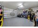 Spacious garage with epoxy flooring and ample storage space at 3235 Utah Dr, Deltona, FL 32738