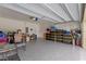 Spacious garage with finished floor and ample room for storage, tools, and vehicles at 3235 Utah Dr, Deltona, FL 32738