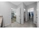 Hallway view showcasing the open floor plan and access to the bedroom, bathroom, and closet at 3235 Utah Dr, Deltona, FL 32738