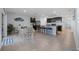 Spacious eat-in kitchen features granite countertops, dark cabinetry and bar seating at 3235 Utah Dr, Deltona, FL 32738