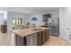 Spacious kitchen featuring granite countertops, stainless steel appliances, and a breakfast bar at 3235 Utah Dr, Deltona, FL 32738