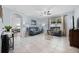Comfortable living room features a stylish seating area, tile floors, lots of natural light, and stylish decor at 3235 Utah Dr, Deltona, FL 32738
