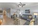 Inviting living room with comfortable seating, stylish decor, tile floors, and lots of natural light at 3235 Utah Dr, Deltona, FL 32738