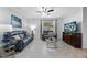 Bright living room features a comfortable seating area, stylish decor, tile floors, lots of natural light, and a TV at 3235 Utah Dr, Deltona, FL 32738