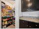 Walk-in pantry with ample shelving for organized storage and easy access at 3235 Utah Dr, Deltona, FL 32738