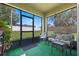 Relaxing screened porch with comfortable seating and view of the outdoors at 3235 Utah Dr, Deltona, FL 32738
