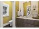 Stylish powder room with elegant vanity and decorative mirror at 3428 Chaine Du Lac Blvd, Windermere, FL 34786