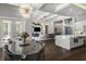 Dining area with pool view and open layout flowing into kitchen and living spaces at 3428 Chaine Du Lac Blvd, Windermere, FL 34786