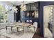 Bright dining area featuring modern table set, stylish decor, and beautiful lighting at 3428 Chaine Du Lac Blvd, Windermere, FL 34786