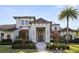 Stunning exterior of a modern home, showcasing a well-kept lawn and complementary landscaping at 3428 Chaine Du Lac Blvd, Windermere, FL 34786