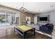 Game room with pool table and comfortable seating area at 3428 Chaine Du Lac Blvd, Windermere, FL 34786
