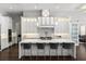 Modern kitchen with a waterfall island, stainless steel appliances, and plenty of cabinet space at 3428 Chaine Du Lac Blvd, Windermere, FL 34786