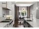Kitchen with bright breakfast nook, stainless steel appliances, and marble countertops at 3428 Chaine Du Lac Blvd, Windermere, FL 34786