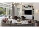 Stylish living room with access to the backyard and stunning views of the outdoors at 3428 Chaine Du Lac Blvd, Windermere, FL 34786