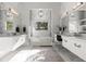 Luxurious main bathroom with dual vanities, marble accents, and a soaking tub at 3428 Chaine Du Lac Blvd, Windermere, FL 34786