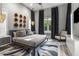 Serene main bedroom featuring a cozy bed, stylish lighting, and elegant decor for a relaxing atmosphere at 3428 Chaine Du Lac Blvd, Windermere, FL 34786