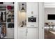 Convenient pantry featuring custom cabinetry and a built-in coffee station at 3428 Chaine Du Lac Blvd, Windermere, FL 34786