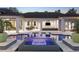 Stunning pool and spa featuring in-pool loungers and an outdoor entertainment area with a fireplace and a grill at 3428 Chaine Du Lac Blvd, Windermere, FL 34786