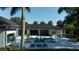 Relaxing pool area with stylish lounge chairs and lush potted plants perfect for entertaining and leisure at 3428 Chaine Du Lac Blvd, Windermere, FL 34786