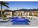A backyard with a pool, lounge chairs, and lush landscaping, creating a serene and private outdoor oasis at 3428 Chaine Du Lac Blvd, Windermere, FL 34786