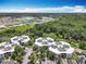 Aerial view of the multi-building complex and surrounding mature landscaping and common areas at 3944 Atrium Dr # 4, Orlando, FL 32822