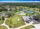Aerial view showcasing golf course, community amenities, and residential buildings at 3944 Atrium Dr # 4, Orlando, FL 32822