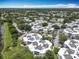 Aerial view of sprawling condo community with lush landscaping and ample parking at 3944 Atrium Dr # 4, Orlando, FL 32822
