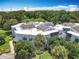 Aerial view of the complex surrounded by lush greenery and well-maintained grounds at 3944 Atrium Dr # 4, Orlando, FL 32822