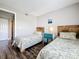 Charming bedroom featuring two twin beds, wood accent headboards, and rustic decor at 3944 Atrium Dr # 4, Orlando, FL 32822