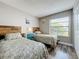 Bedroom with two beds, wood floors, bedside tables and rustic wood headboards at 3944 Atrium Dr # 4, Orlando, FL 32822