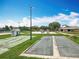 Bocce ball and shuffleboard courts in a community park, with play areas nearby and lush green surroundings at 3944 Atrium Dr # 4, Orlando, FL 32822