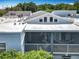 A view of the screened in porch and roof of the home, with chairs and a hammock visible at 3944 Atrium Dr # 4, Orlando, FL 32822