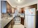 Well-appointed kitchen features granite counters, stainless steel appliances, and plenty of cabinet storage space at 3944 Atrium Dr # 4, Orlando, FL 32822