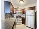 Well-appointed kitchen features granite counters, stainless steel appliances, and ample cabinet storage space at 3944 Atrium Dr # 4, Orlando, FL 32822