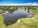 Lake and golf course aerial view highlighting the beautiful scenery and lush landscaping at 3944 Atrium Dr # 4, Orlando, FL 32822