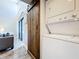 Convenient in-unit laundry closet with stacked washer and dryer and sliding barn door for added charm at 3944 Atrium Dr # 4, Orlando, FL 32822