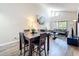 Bright living room features a dining area, a sliding glass door, and soaring ceilings with an abundance of natural light at 3944 Atrium Dr # 4, Orlando, FL 32822