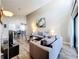 Living room with high ceilings, comfortable seating and a large window offers an inviting space to unwind and entertain at 3944 Atrium Dr # 4, Orlando, FL 32822