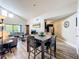 Open-concept living space with dining area, a large window, comfortable seating and updated wood-look flooring at 3944 Atrium Dr # 4, Orlando, FL 32822