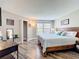 Comfortable main bedroom with wood-look flooring, a large window and ample natural light throughout at 3944 Atrium Dr # 4, Orlando, FL 32822