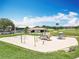 Community playground featuring slides, swings, and climbing structures with golf course view at 3944 Atrium Dr # 4, Orlando, FL 32822