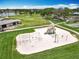 Community playground with swings, slides, and climbing structures, surrounded by green spaces and recreational areas at 3944 Atrium Dr # 4, Orlando, FL 32822