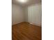 Cozy bedroom with wood floors and a window with blinds at 622 Dreama Dr, Davenport, FL 33897