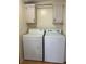 Laundry room with washer and dryer and white cabinets at 622 Dreama Dr, Davenport, FL 33897